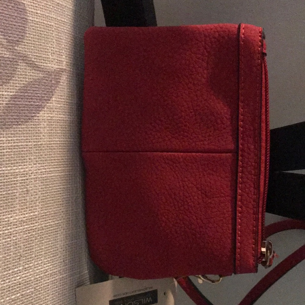 Brand new never worn new with tags!! Small red Wilson wristlet